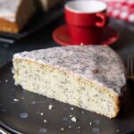 A slice French Poppy Seed Cake, served with an espresso.