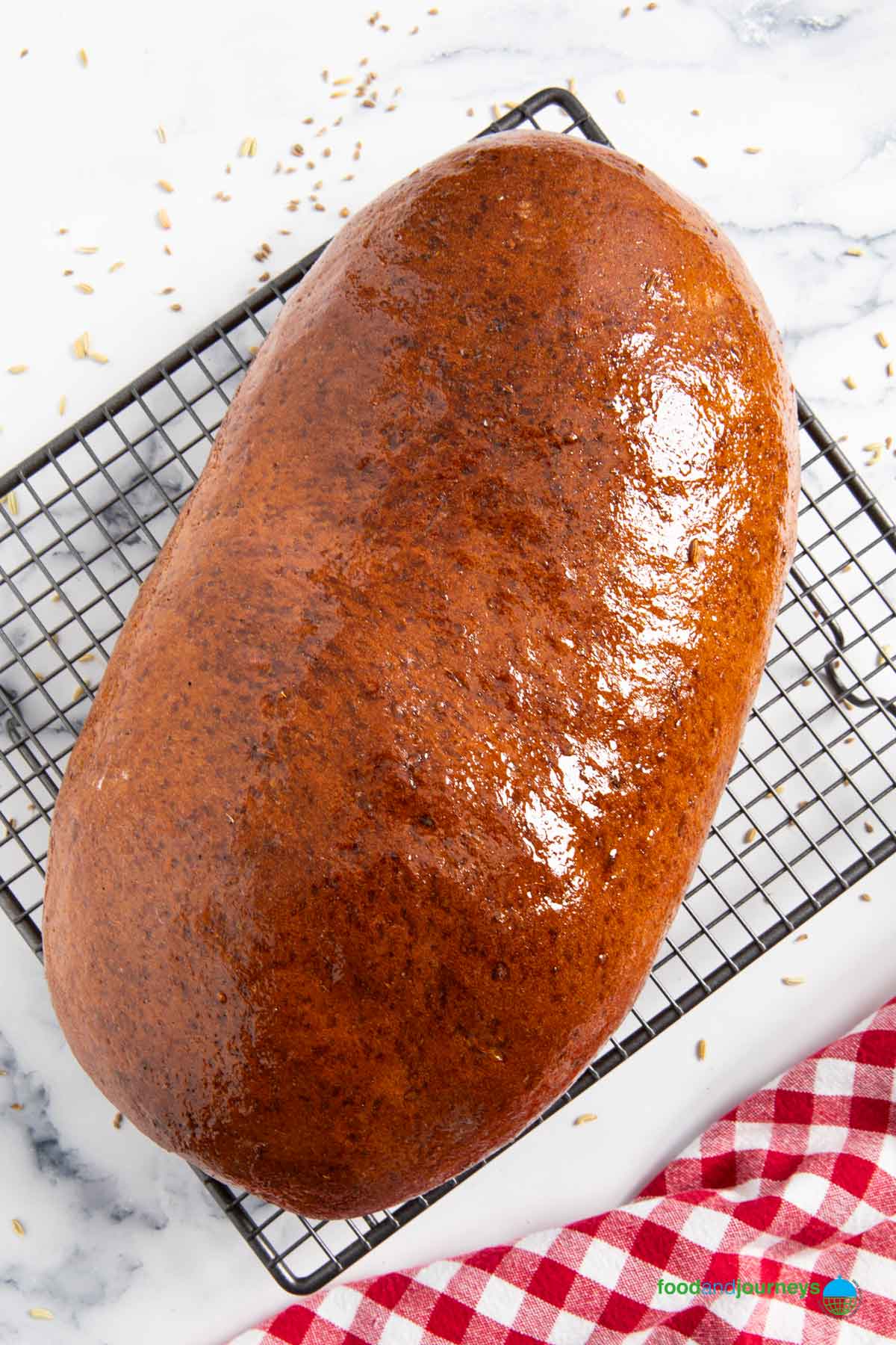 A freshly baked Swedish limpa, cooling on a rack.