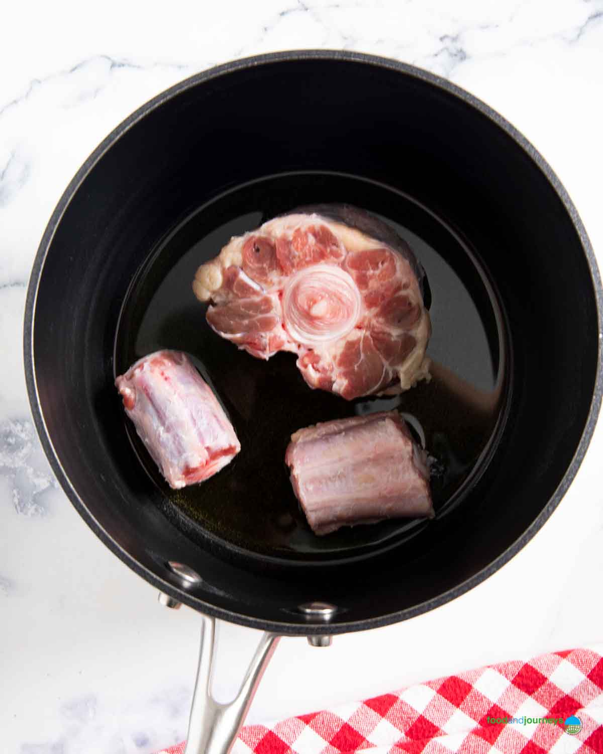 Browning the oxtail is the first step in making this authentic soup from Germany.