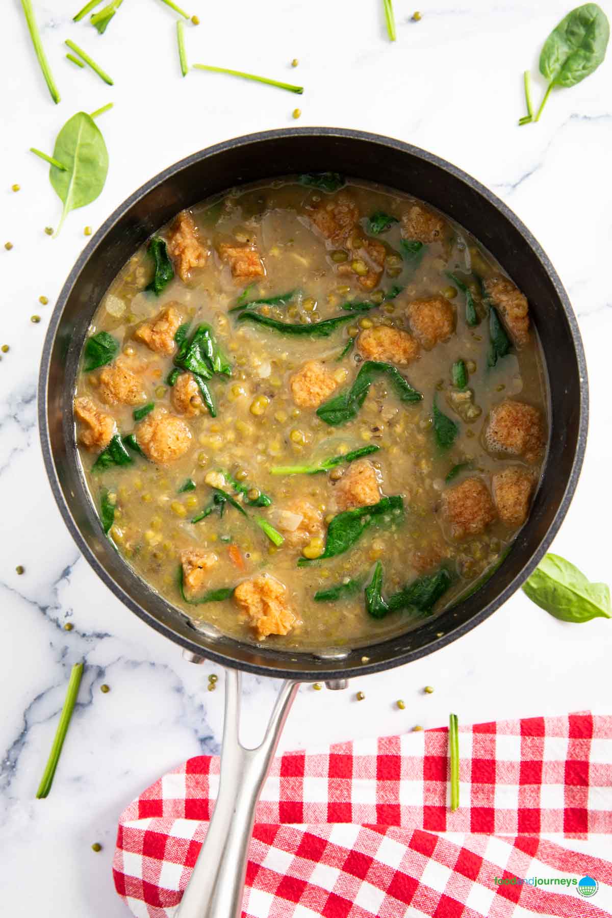 A sauce pan off the heat, traditional ginisang munggo with pork ready for serving.