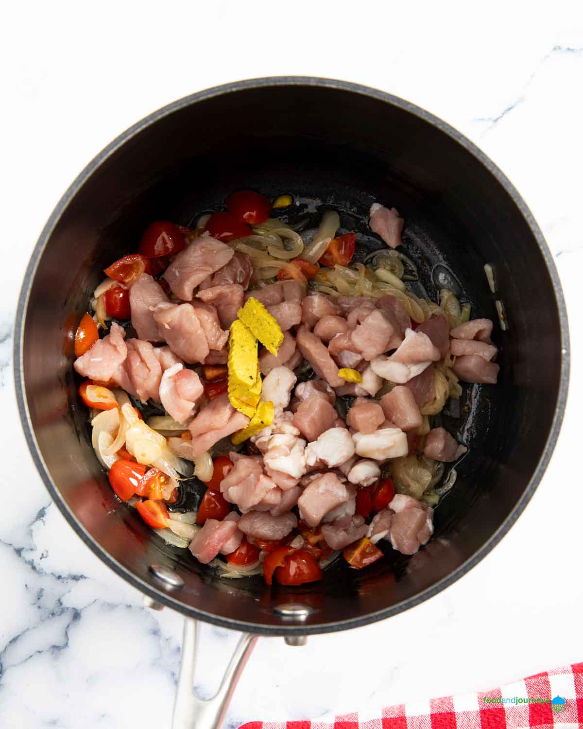 Sautéing the pork bits with the garlic and onion for the base flavor of Filipino mung bean soup.