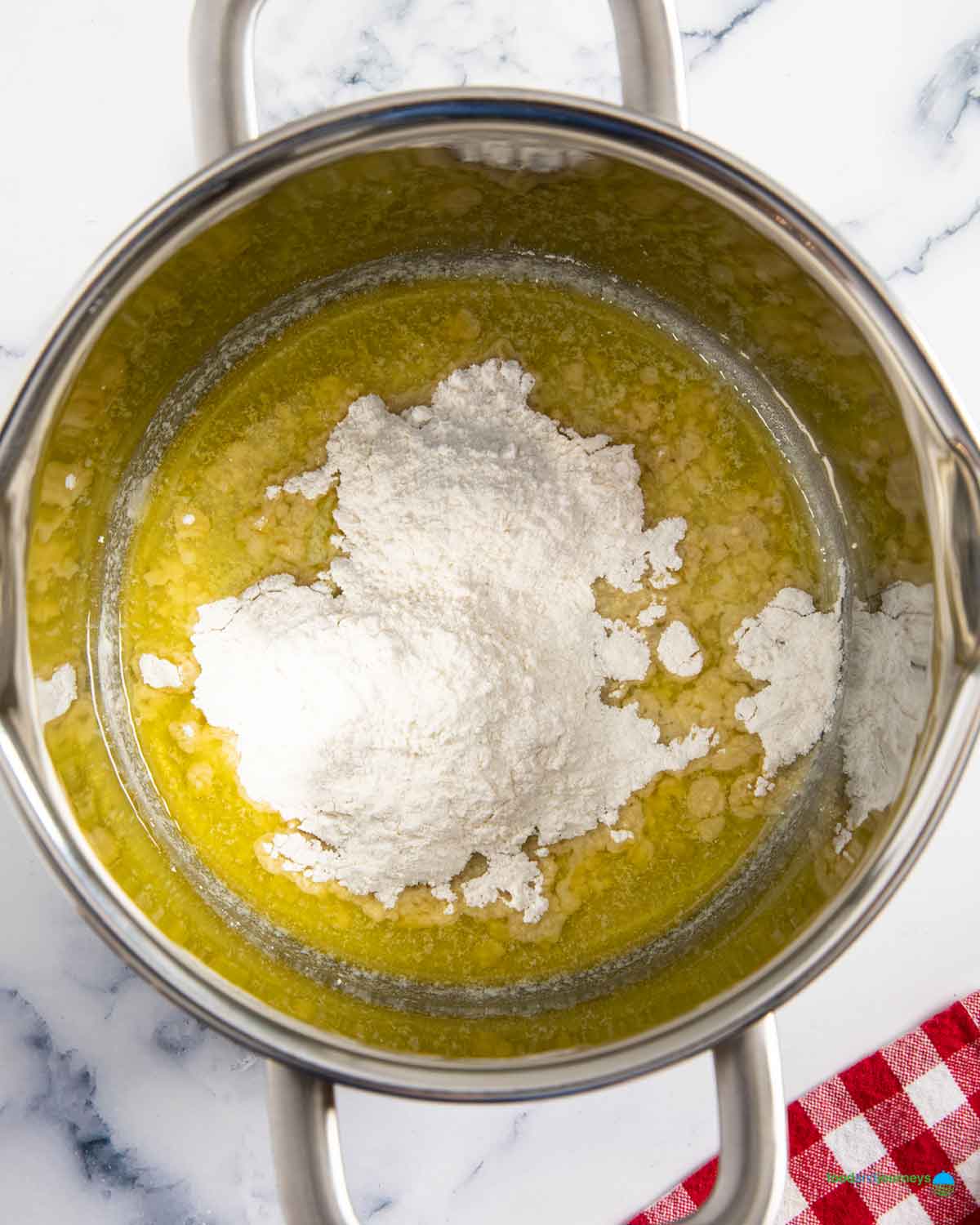 Preparing the béchamel sauce for the filling of the summer vegetable tart.