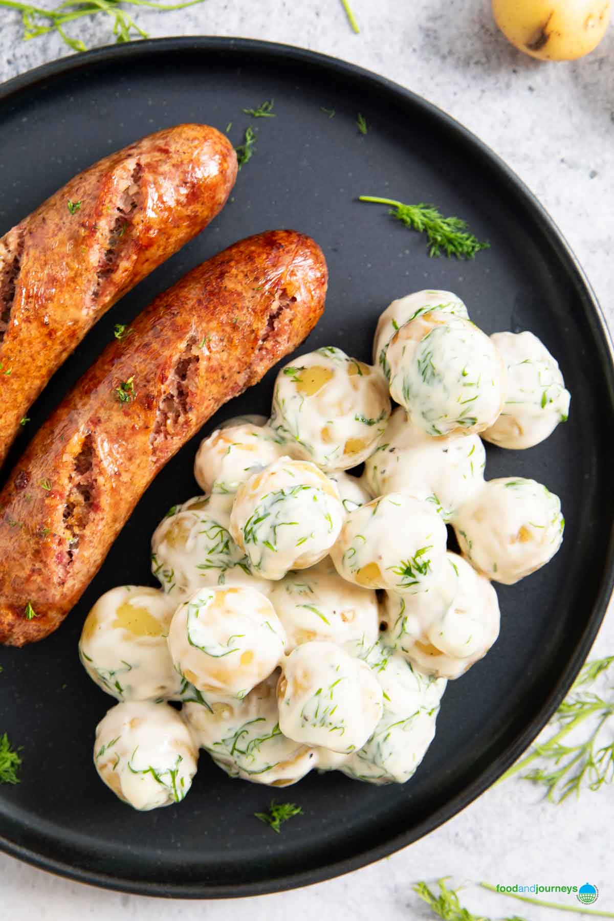Swedish dill cream potatoes served with grilled sausage.