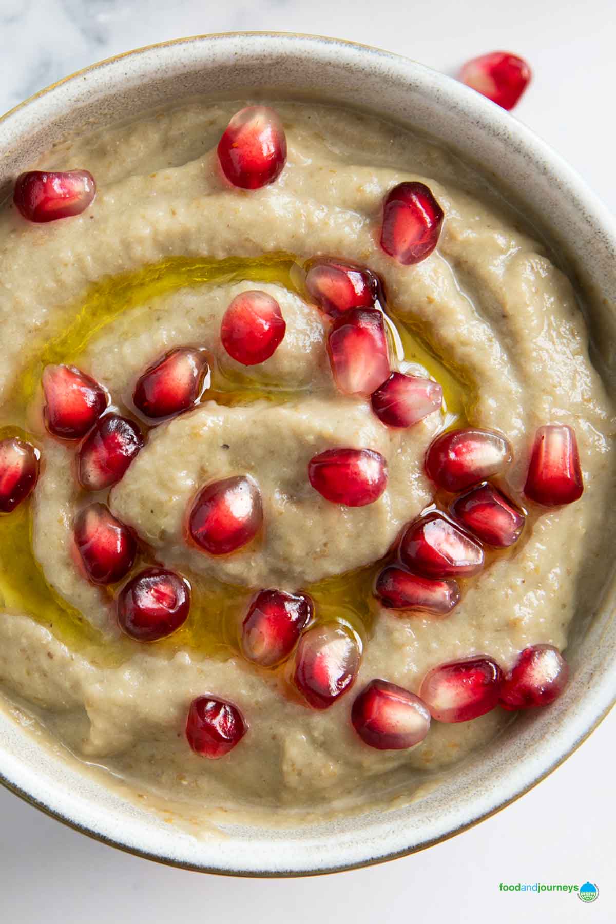 An overhead shot of a bowl of baba ganoush, a traditional recipe from Lebanon.