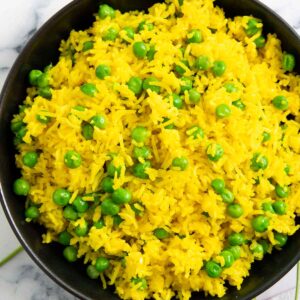 A serving of Mexican yellow rice, highlighting its fluffy texture.