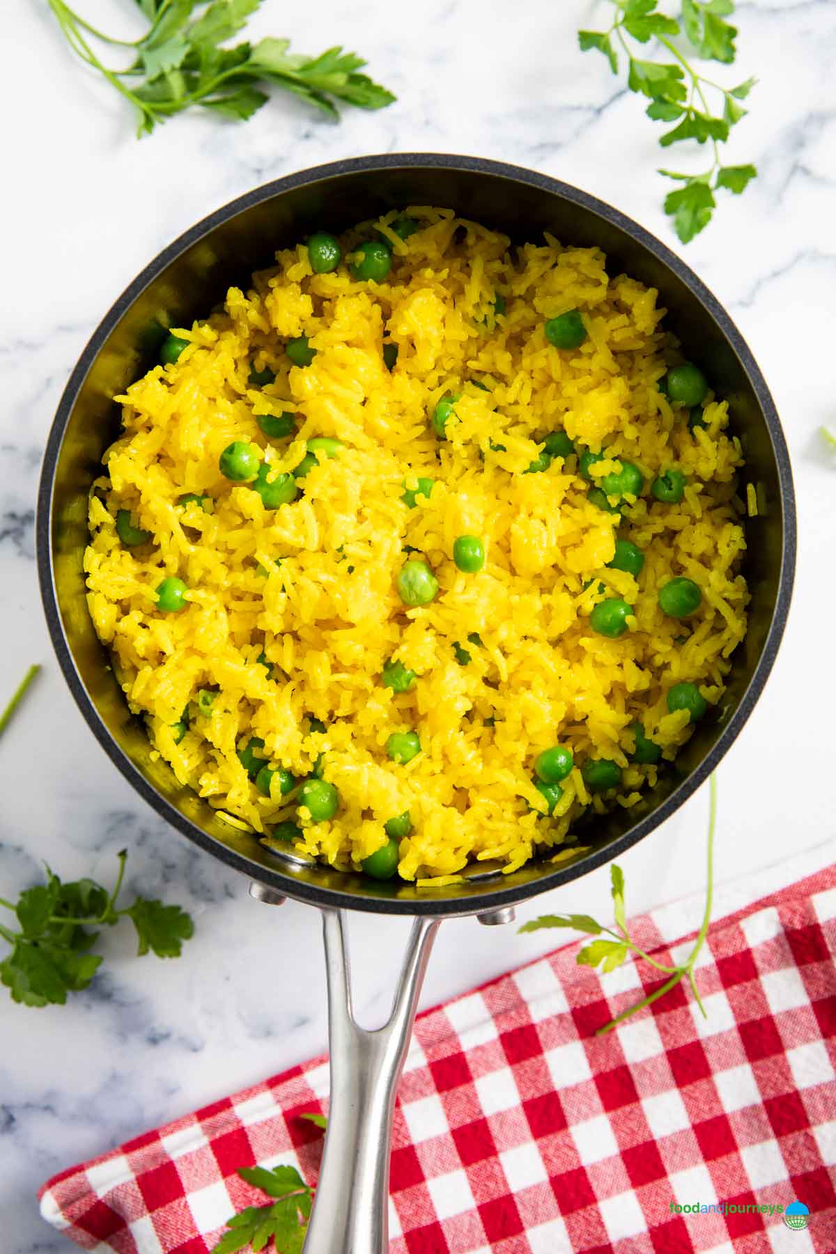 A pan of Mexican yellow rice, ready for transferring into plates, and serving.