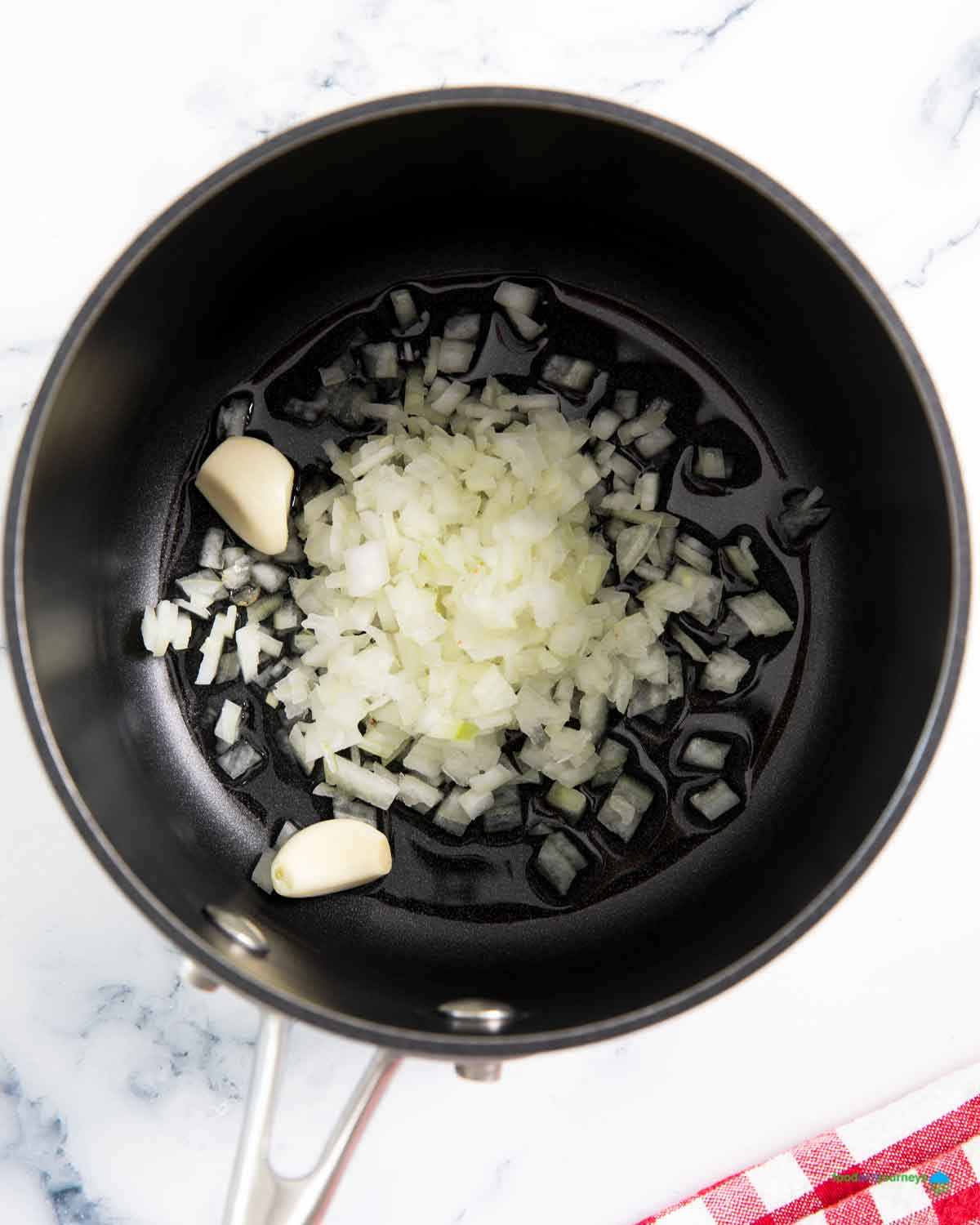 Sautéing garlic and onion is the first step in making traditional yellow rice from Mexico.