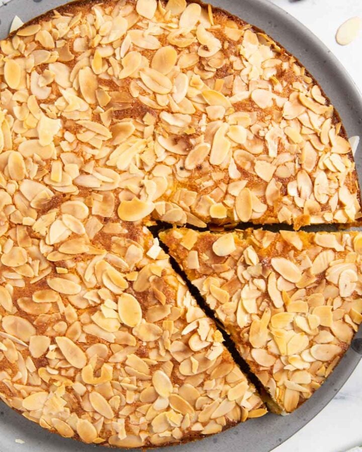 Traditional Swedish almond cake, with a slice ready for serving.