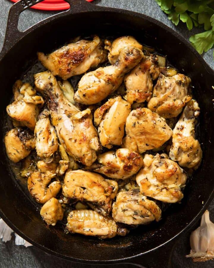 A pan of pollo al ajillo, fresh out of the stove, ready for serving.