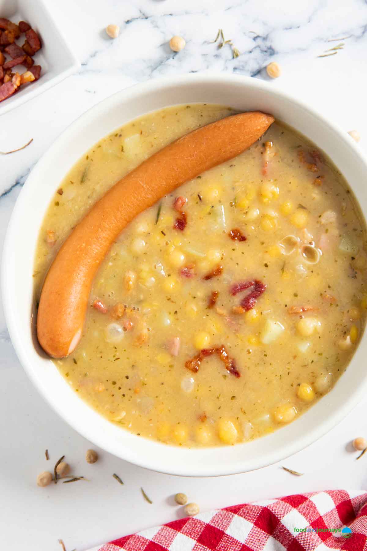 German sausage added into the bowl of pea soup, another way that locals prefer to serve the soup.