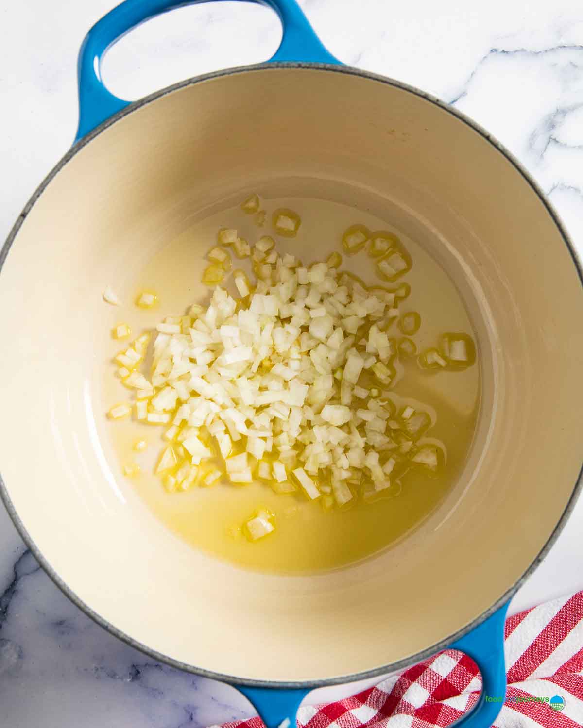 Sautéing the onion and garlic is the first step in making this traditional, one-pot beef kaldereta at home.