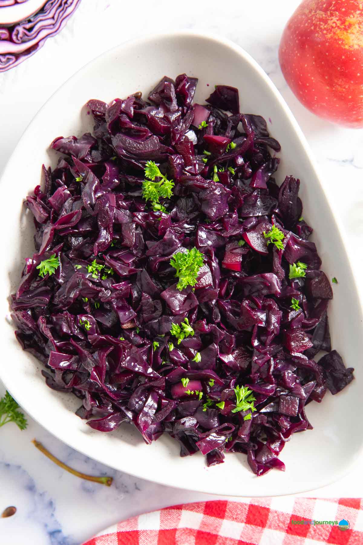 An overhead shot of a serving of Swedish red cabbage, braised in low heat, highlighting the bits of tender red cabbage and apples.