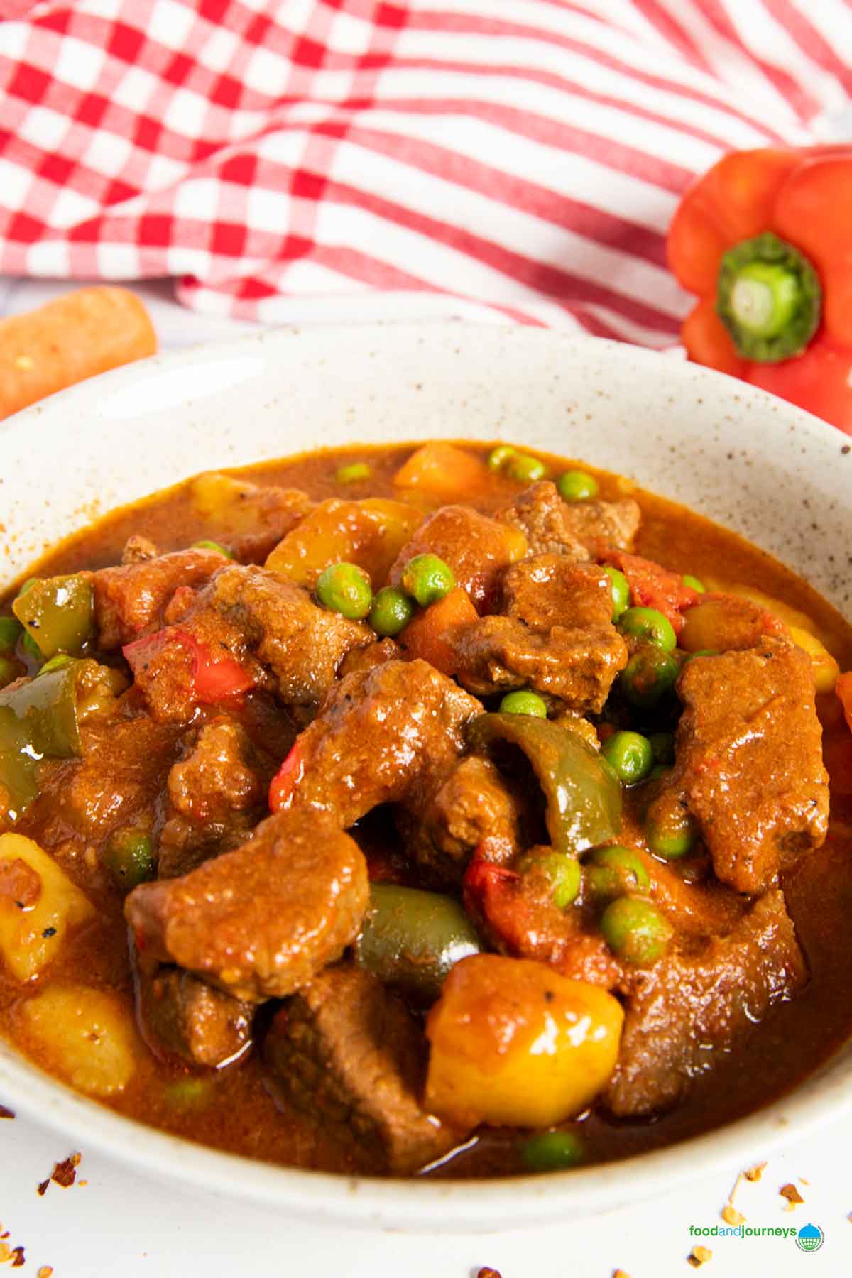 A closer shot of Filipino kaldereta with beef, highlighting its thick sauce.